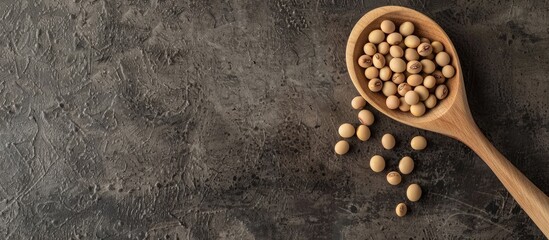 Canvas Print - A wooden spoon holds soybeans on a table, a wholesome plant protein, with a blank space ideal for an image.