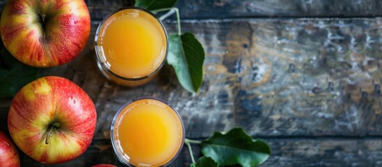 Poster - Chilled apple juice filled with pulp, unfiltered and unclarified, a refreshing vitamin-packed summer drink with apples, viewed from the top with copy space image.