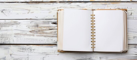 Leinwandbilder - White wooden background with an open notebook that has clips for papers, providing space for copying images.