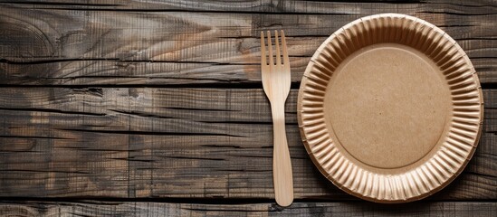 Aufkleber - Eco-friendly paper plate and fork set displayed on a rustic wooden table with ample space for adding text or images.