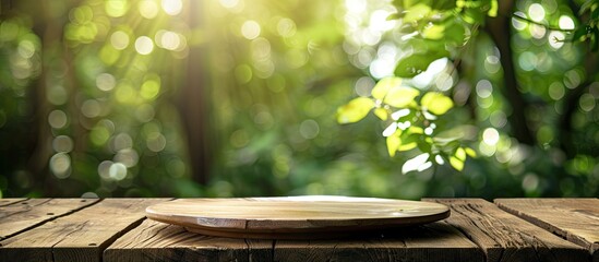 Aufkleber - Wooden table with empty plate on top against a green blurred background. Copy space image available.