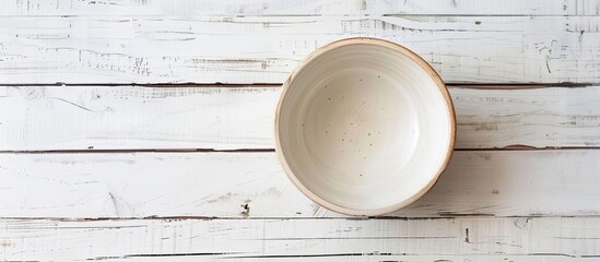 Aufkleber - Top-down view of an empty ceramic bowl on a white wooden table, with room for adding text or a copy space image included.