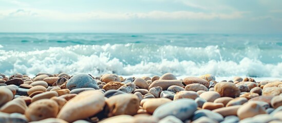 Poster - Spanish beach with stones featuring a copy space image.