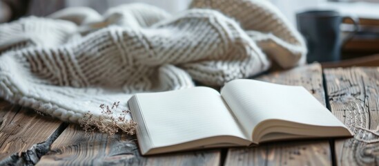 Fototapete - White sheet with a notebook, creating copy space; selective focus included.