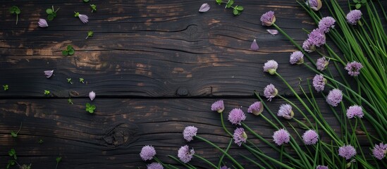 Sticker - Dark wooden backdrop with blooming chives and pansies, creating an elegant aesthetic for a copy space image.