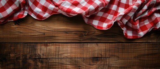 Aufkleber - Checkered red and white tablecloth displayed on wooden background with copy space image.