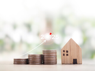 Poster - Miniature house and stack of coins with arrow rising. The concept about price of house is growing up, Property investment, House mortgage, Real estate in year 2025