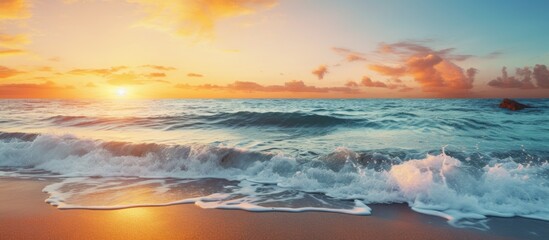 Poster - Sunset seascape with waves splashing on the shore, the sun reflecting on the sea, and clear sky, perfect for beach and nature concepts, has copy space image.