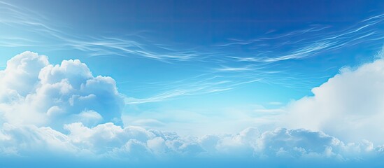 Poster - Blurry sky and clouds with a bright blue gradient background create an abstract backdrop with copy space image.