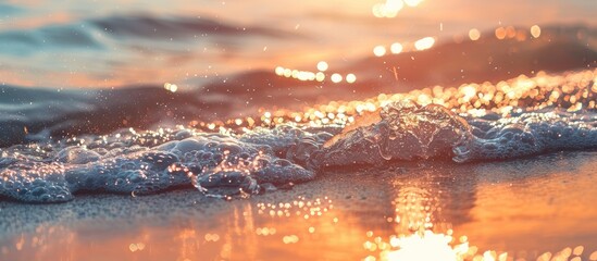 Poster - Beautiful sunset view over the sea with sparkling waves on the sandy beach on a sunny summer day, creating a serene water background, ideal for including copy space image.