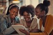© vefimov - Three women sitting at a table reviewing a tablet, possibly discussing or sharing content