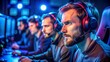 © Komkrit - a group of men wearing headphones in a gaming room