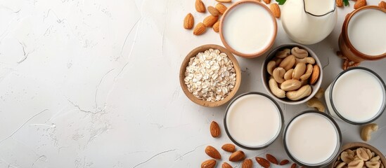 Poster - assorted vegan almond and cashew milk displayed on a table with a top view featuring a copy space im
