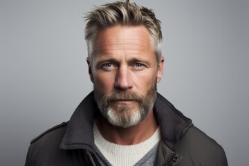 Poster - Portrait of a handsome middle-aged man with grey hair and beard.