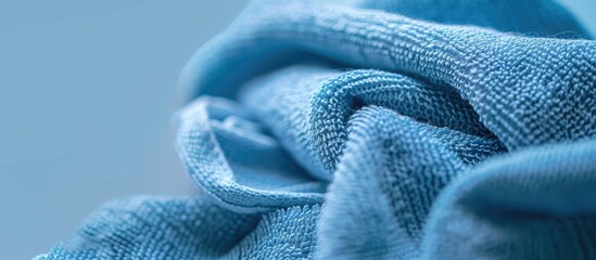 Blue dry microfiber cloth for cleaning and dust removal close up view with copy space image