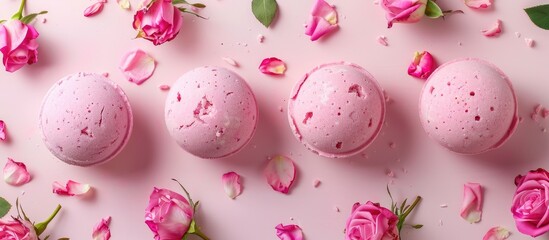 Aufkleber - Rose bath bombs displayed on a pink backdrop with plenty of copy space image