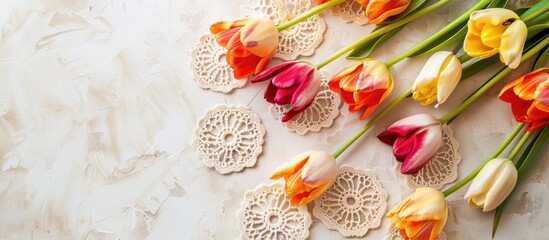 Aufkleber - Top view photo featuring vibrant retro tulips and lace circles on a clean backdrop with ample copy space image