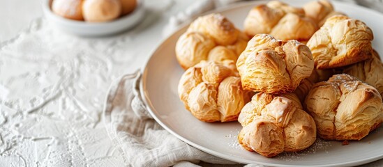 Aufkleber - Choux pastries made with minimal ingredients like butter water flour and eggs Present on a white plate with space for adding text or images Image with focused display. with copy space image