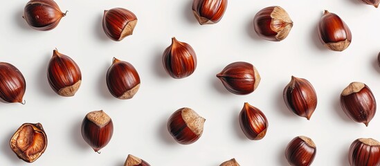 Poster - Top down view of ripe sweet chestnuts with a chestnut pattern isolated on a white background ideal for Christmas food promotions with copy space image
