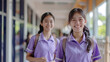 © JKLoma - asian young student with bestfriend running at school corridor wearing uniform with happy smile,generative ai