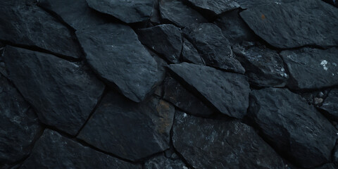 Wall Mural - textured dark stone wall with irregular shapes and rough edges. ideal for backgrounds, textures, or 