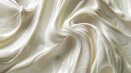 A close-up of white cream with a smooth, luscious texture, perfect for background use.