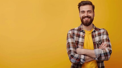 Wall Mural - People With Solid Background. Smiling Young Man in Casual Shirt Standing in Studio Shot on Yellow Background