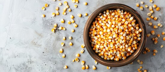 Poster - A bird s eye view of corn kernels in a bowl with copy space image against a light gray backdrop