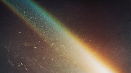 Blur colorful warm rainbow light leaks on black background with dust texture.