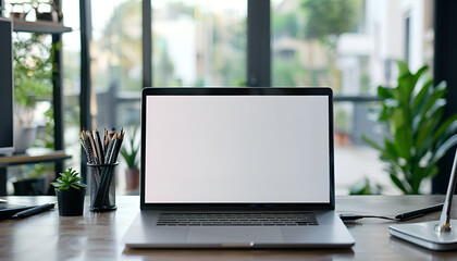 Laptop device mock up template design on office workplace desk, white mockup empty blank computer screen on office work table business web technology at modern workspace, closeup