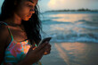 © Purple_Lamp - Woman Using  at Sunset Beach  Serene, Contemplative, Summer Evening