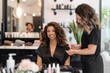 © id512 - smiling client African American woman receiving professional hair and makeup service in stylish modern beauty salon
