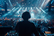 © Silard - Back view of a DJ playing music on a rave party at the club