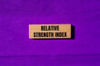 © Emre Akkoyun - Relative strength index message written on wooden blocks with purple background. Conceptual relative strength index symbol. Copy space.