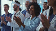 © VK Studio - A group of healthcare professionals celebrating with joyous applause in a brightly lit room, capturing moments of achievement and camaraderie.
