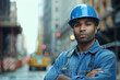 © Babb - A man in a blue shirt and a blue hard hat is standing on a street