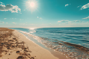 Poster - A beautiful beach with a clear blue ocean and a bright sun shining on the water