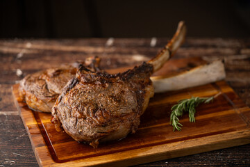 Sticker - grilled tomahawk steak on cutting board