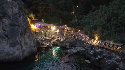 Wall Mural - Beautiful seascape at Paleokastritsa , La grotta beach, a small bay with emerald green water in corfu island,Greece , Aerial drone view by night