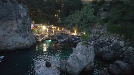 Wall Mural - Beautiful seascape at Paleokastritsa , La grotta beach, a small bay with emerald green water in corfu island,Greece , Aerial drone view by night