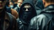 © Nicholas - Hooded figure standing among a crowd of people, with urban background creating a sense of mystery, anonymity, and social commentary on city life and individualism.