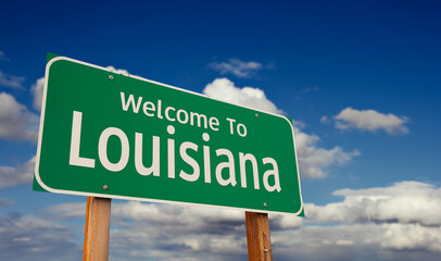 Wall Mural - Welcome To Louisiana Green Road Sign Over Blue Sky with Some Clouds.