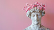 © douniasara - White statue with pink flowers, a romantic and delicate concept for spring and love.