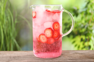 Sticker - Freshly made strawberry lemonade in jug on wooden table outdoors