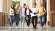 © Prostock-studio - Multiracial students walking after classes in university campus, chatting outdoors