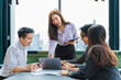 © Akarawut - Team of young Asian entrepreneur have small team meeting for upcoming project for marketing and sale management with skyscraper view for business startup and education concept
