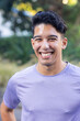 © Wavebreak Media - Smiling man in casual shirt standing outdoors, enjoying sunny day