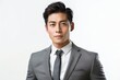 © Nia™ - asian business people man good looking in studio. portrait businessman in grey suit confident friendly face isolated on white background - generative ai