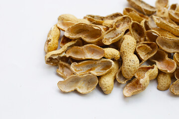 Wall Mural - Peanut shells on white background.