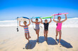 © Brocreative - Group of young girls carrying their boogie boards at the beach after playing in the scenic Pacific Ocean. Fun summer lifestyle concept photo